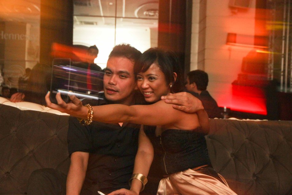 Martha Comia uses word of the year: SELFIE with Bong Cabrera at the ILO ILO SLUMBER PARTY in OPUS last December 2, 2013. Catch the CANNES and Golden Horse award winning film ILO ILO in Philippine theaters NOW. Photo by Jude Bautista