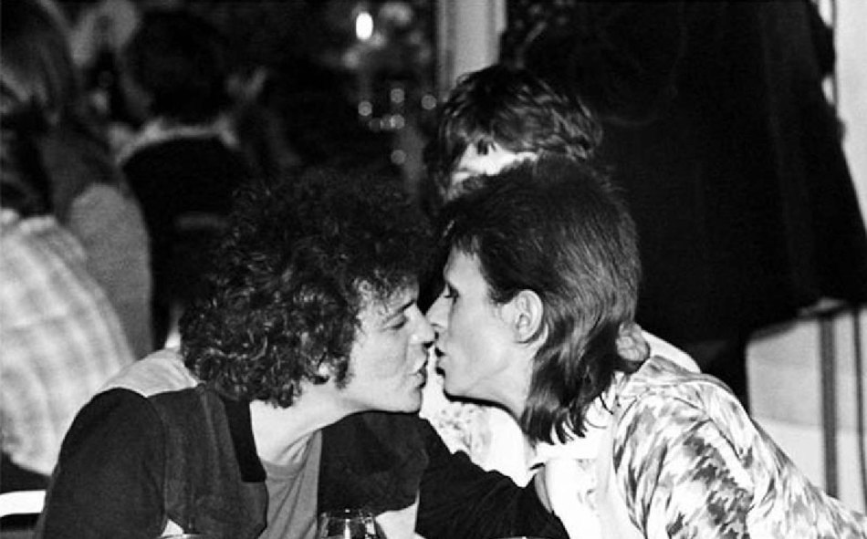New wave progenitors Lou Reed & David Bowie kiss right on the lips.
